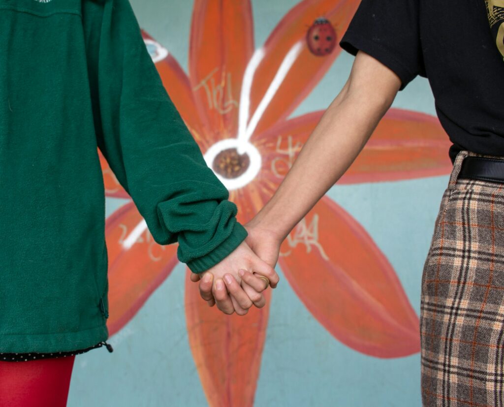 Teens holding hands